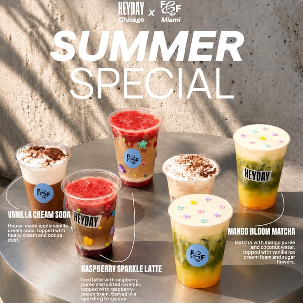 Five colorful Heyday and F&F summer special drinks on a metal table with dappled sunlight.